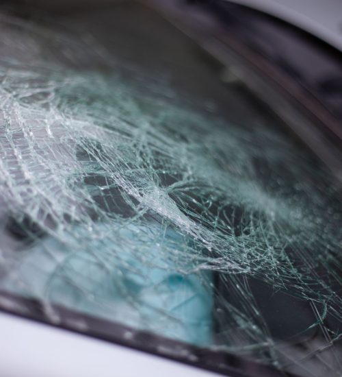 A broken car windshield after an accident