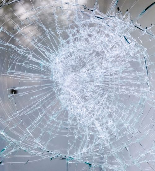 Detail of a broken glass of a window.
