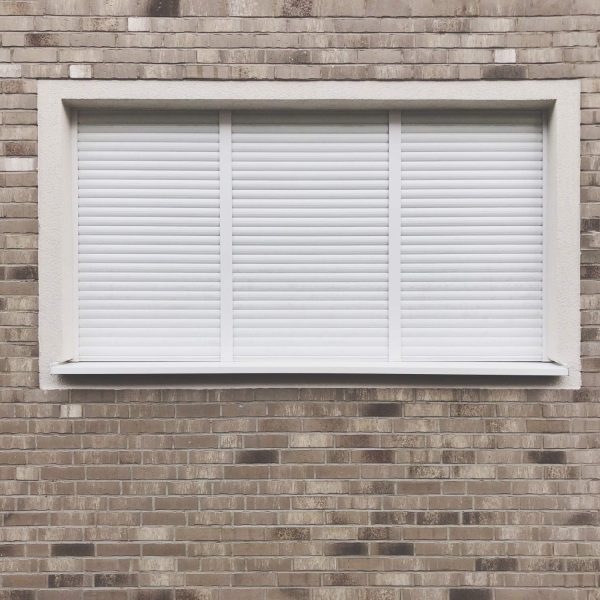 window-with-closed-roller-shutter-blinds-2022-11-09-19-51-38-utc-1