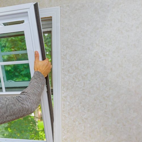 Worker in the installing new, windows in an house new window in the home renovation living energy efficiency