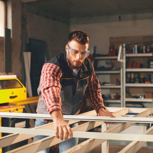 Young men in pvc carpentry workshop